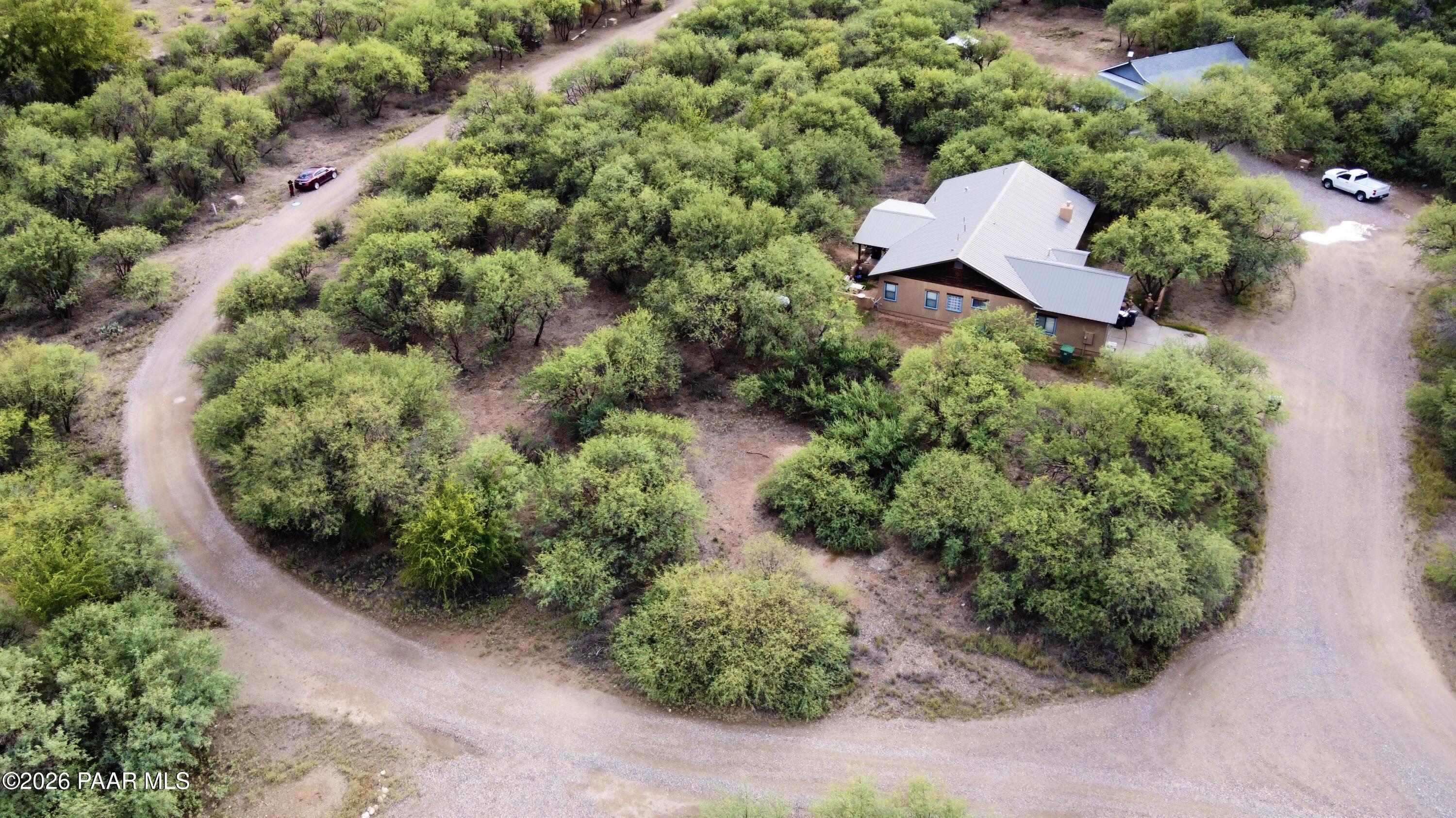 4755 East Lynn Court Lake Montezuma, AZ 86335 - Photo 35 of 36 an aerial view of a house with a yard and lake view