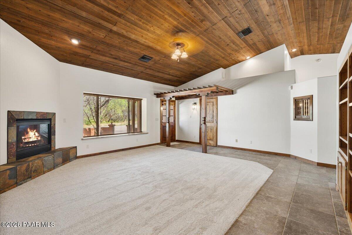 4755 East Lynn Court Lake Montezuma, AZ 86335 - Photo 5 of 36 a view of an empty room with a fireplace and a window