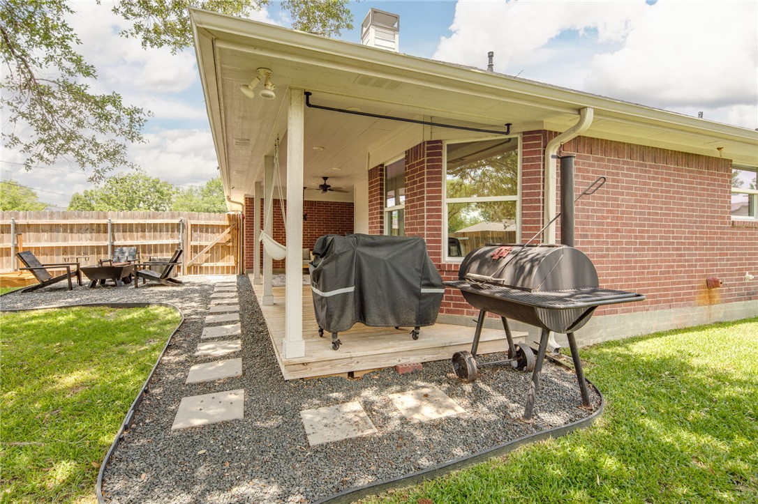 4700 Kensington Road Bryan, TX 77802 - Photo 28 of 31 A covered porch and a gravel patio with stepping stones