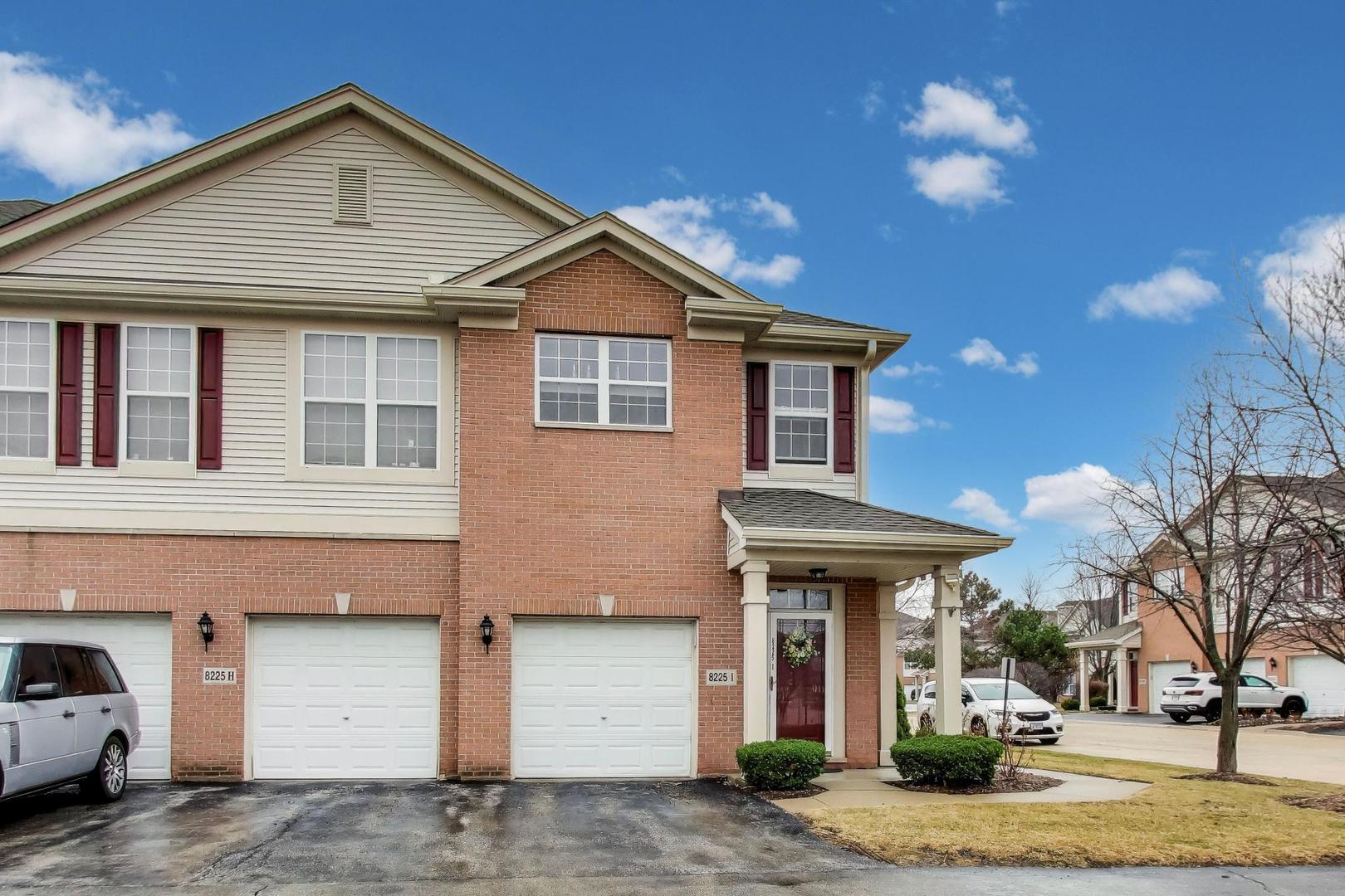 8225 Concord Lane, Unit I Justice, IL 60458 - Photo 1 of 28 a front view of a house with garden