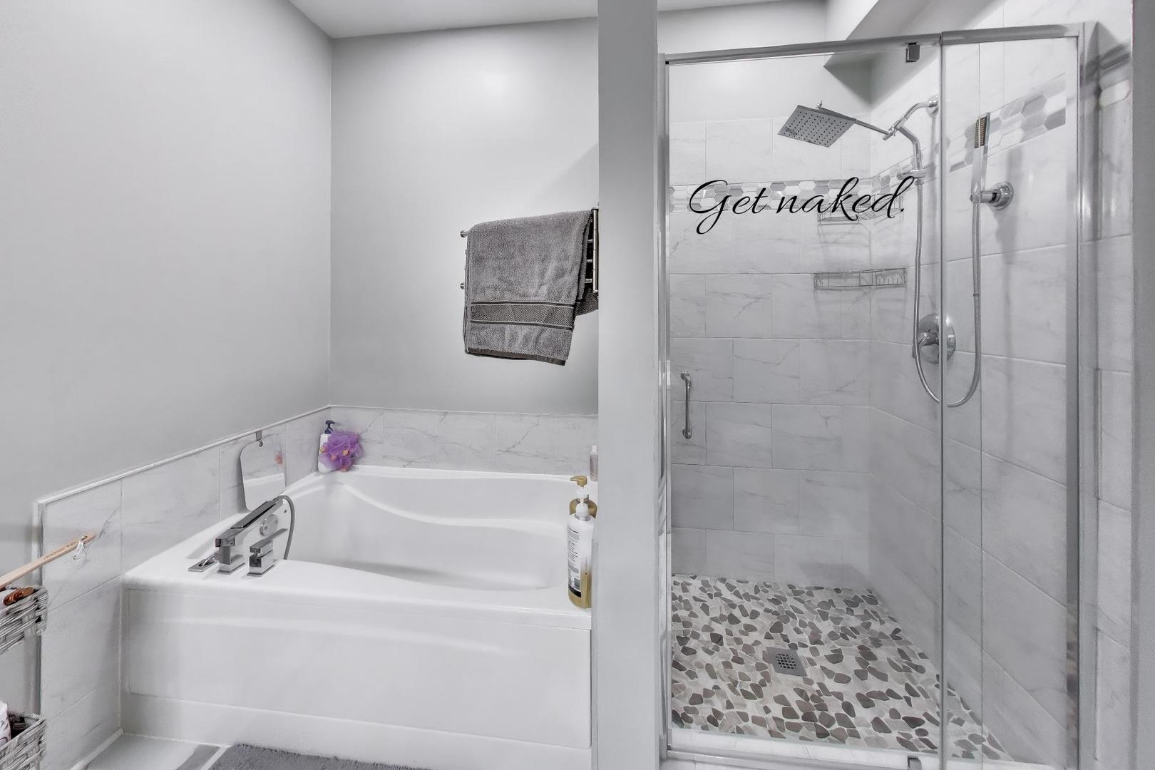 8225 Concord Lane, Unit I Justice, IL 60458 - Photo 17 of 28 a bathroom with a sink and a shower