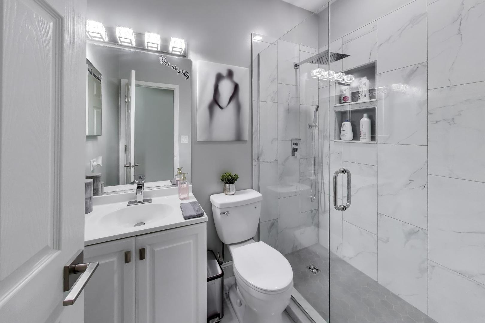 8225 Concord Lane, Unit I Justice, IL 60458 - Photo 20 of 28 a bathroom with a sink toilet and shower
