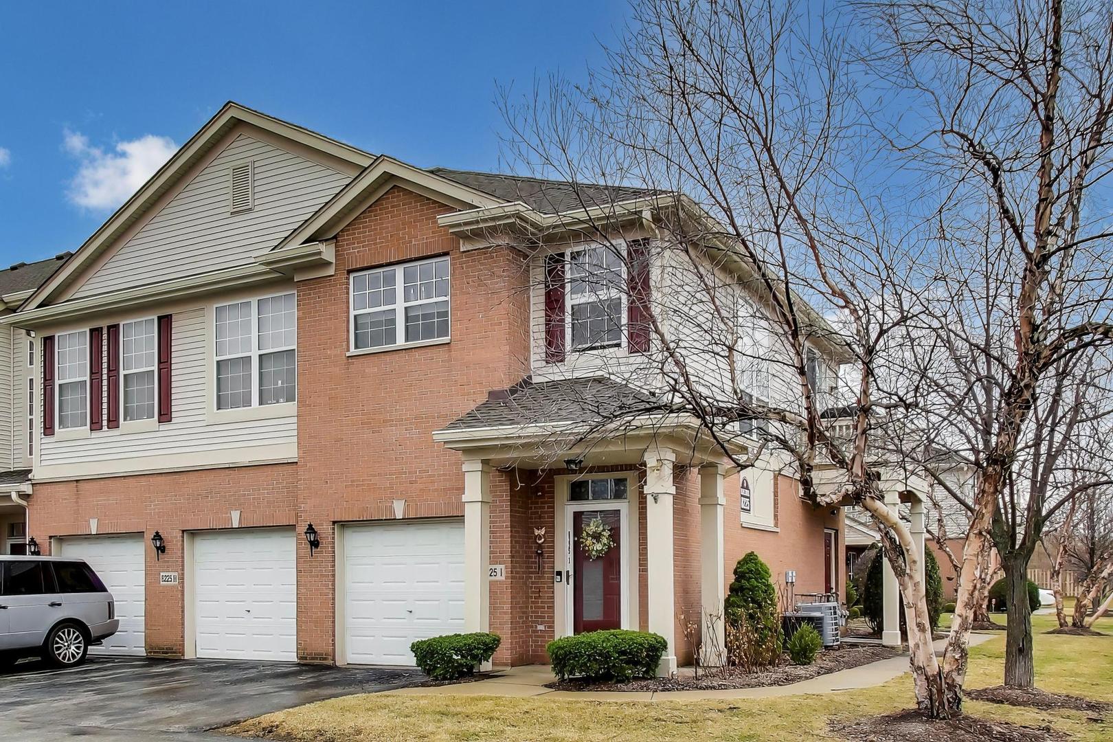 8225 Concord Lane, Unit I Justice, IL 60458 - Photo 2 of 28 a front view of a house with garden