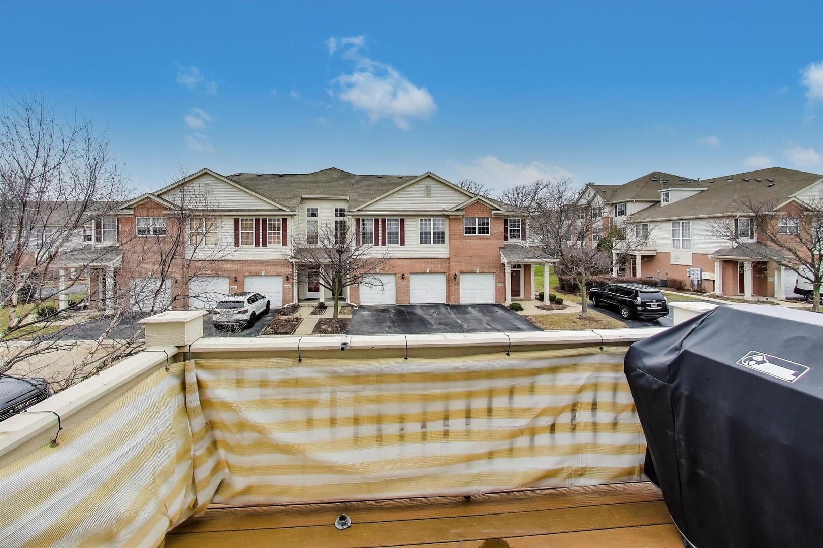 8225 Concord Lane, Unit I Justice, IL 60458 - Photo 22 of 28 a front view of a house with a yard