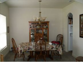 3221 Merrick Avenue Rockledge, FL 32955 - Photo 4 of 12 a view of a dining room with furniture and chandelier