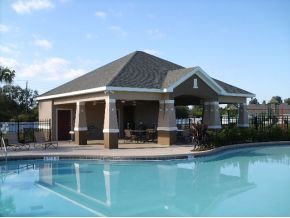 3221 Merrick Avenue Rockledge, FL 32955 - Photo 10 of 12 a backyard of a house with yard table and chairs
