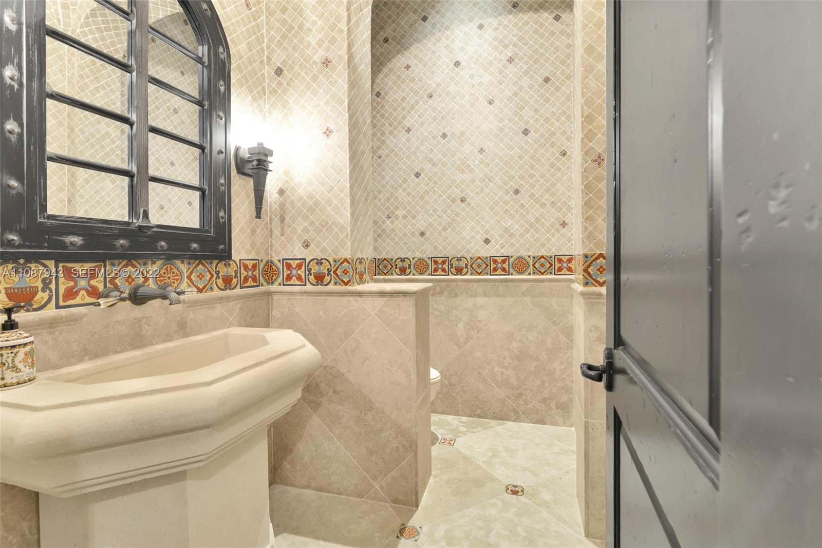 17828 Scarsdale Way Boca Raton, FL 33496 - Photo 23 of 100 a bathroom with a sink a toilet and shower