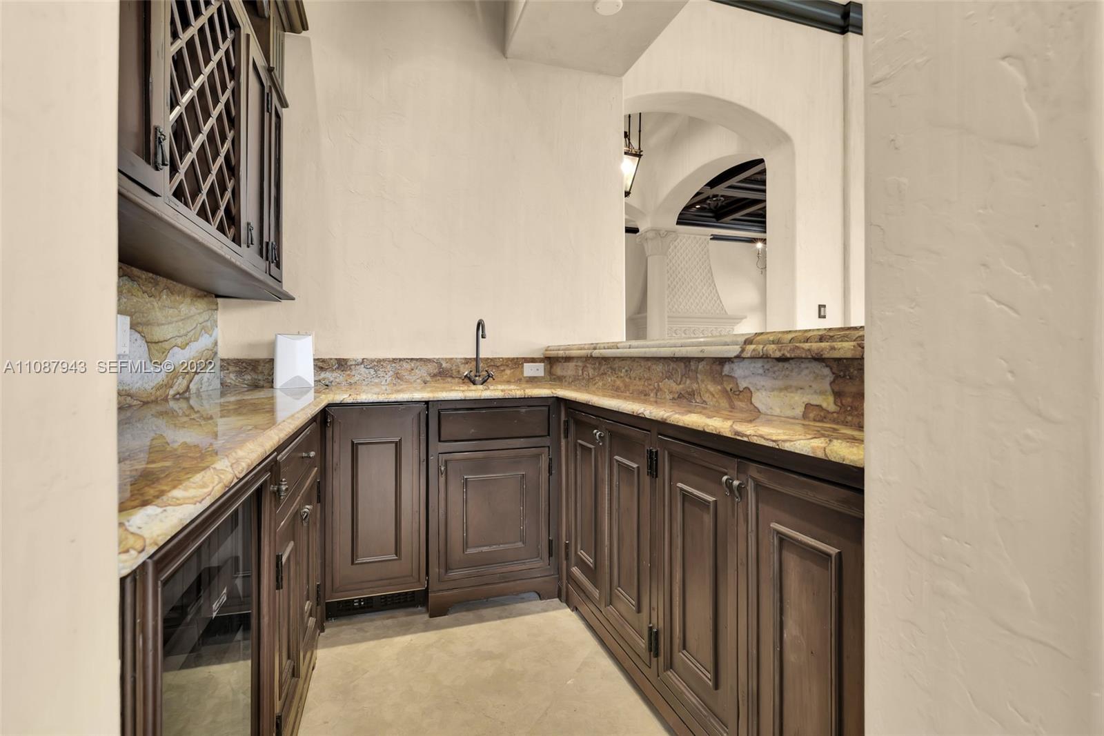 17828 Scarsdale Way Boca Raton, FL 33496 - Photo 44 of 100 a kitchen with a sink stove and cabinets