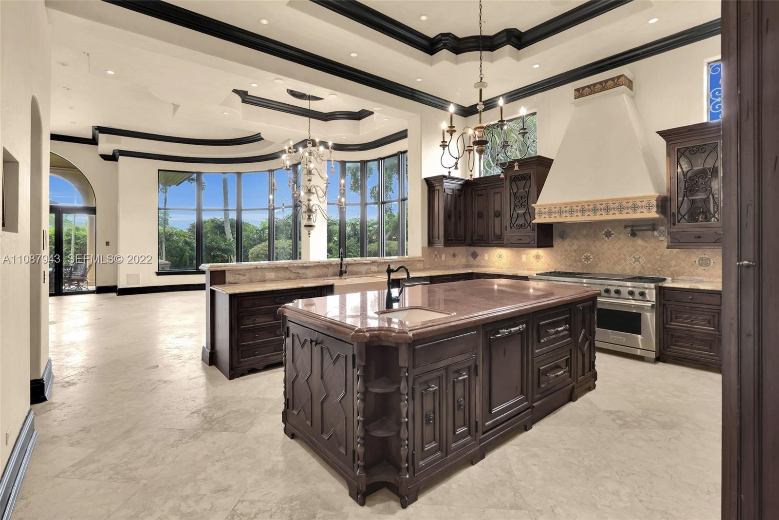 17828 Scarsdale Way Boca Raton, FL 33496 - Photo 52 of 100 a kitchen with stainless steel appliances granite countertop a sink a stove and a refrigerator