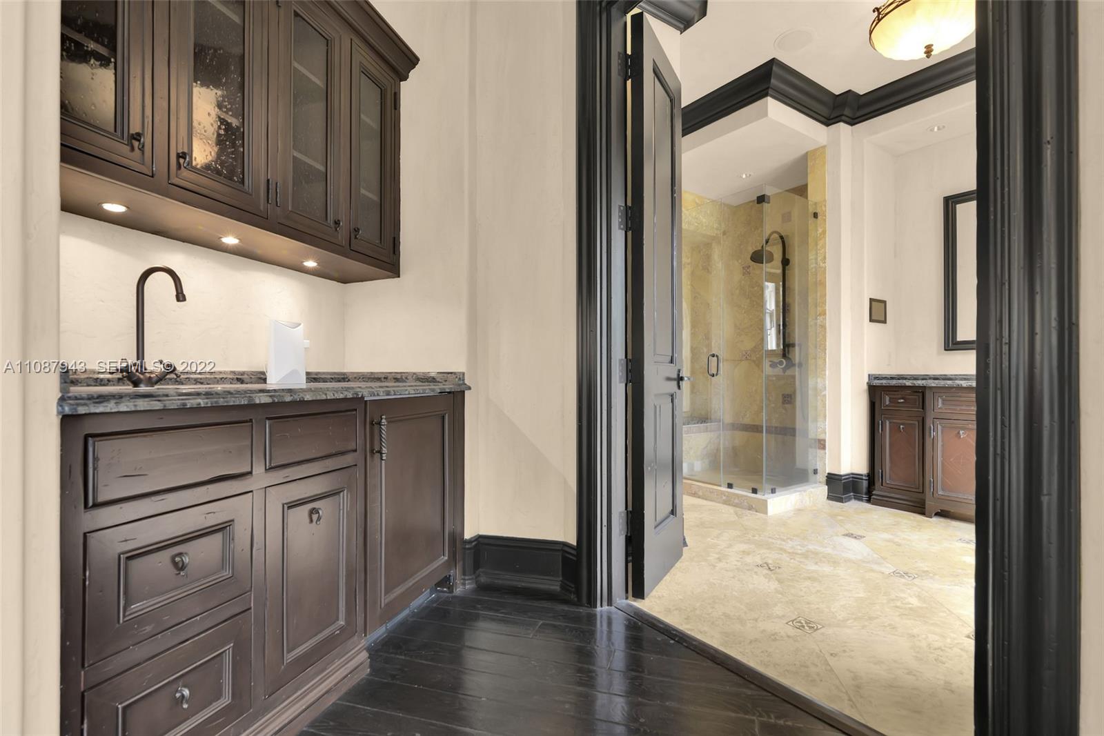 17828 Scarsdale Way Boca Raton, FL 33496 - Photo 60 of 100 a bathroom with a sink and a mirror