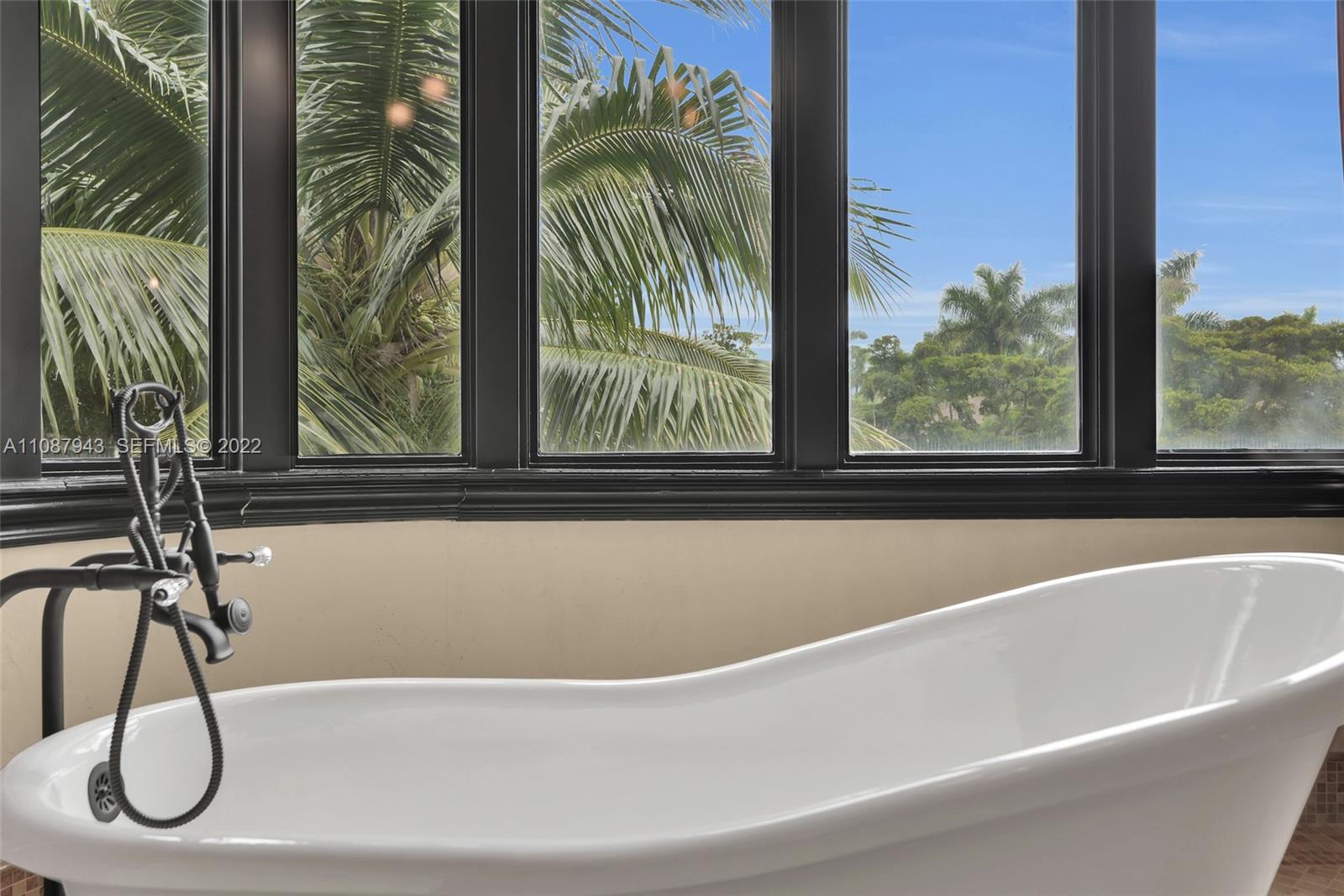 17828 Scarsdale Way Boca Raton, FL 33496 - Photo 69 of 100 a bathroom with a bathtub and next to a window