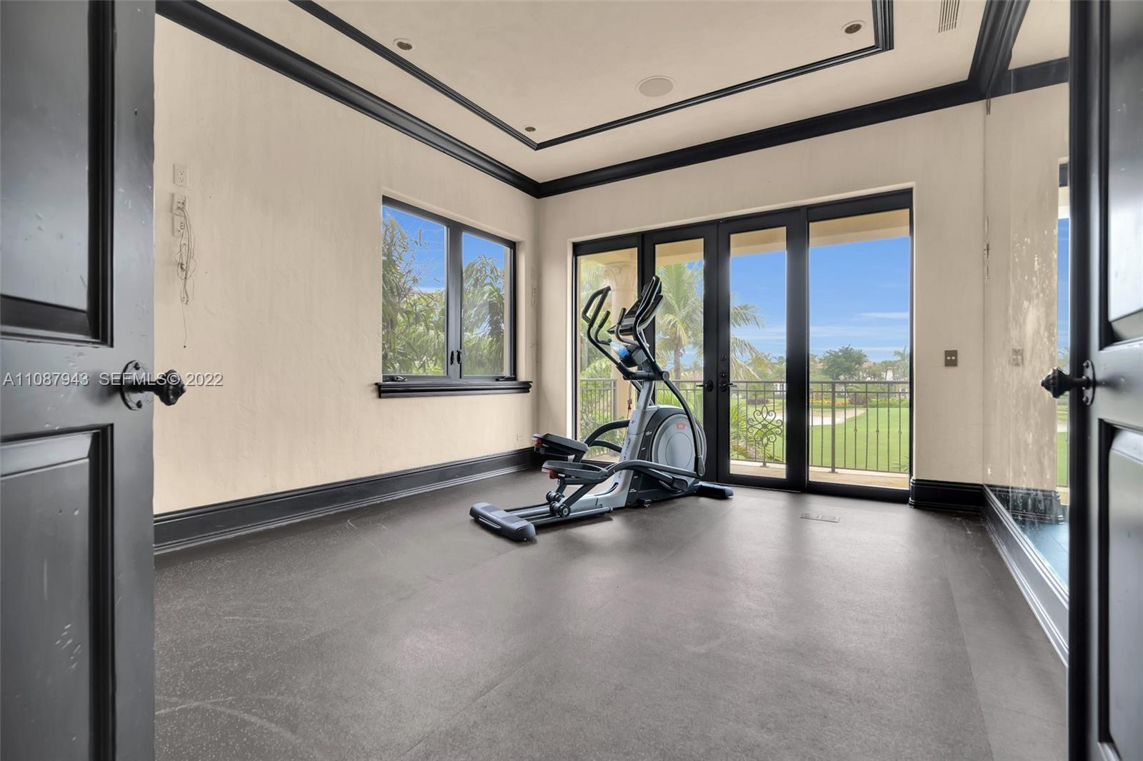 17828 Scarsdale Way Boca Raton, FL 33496 - Photo 72 of 100 a view of a room with gym equipment and floor to ceiling window
