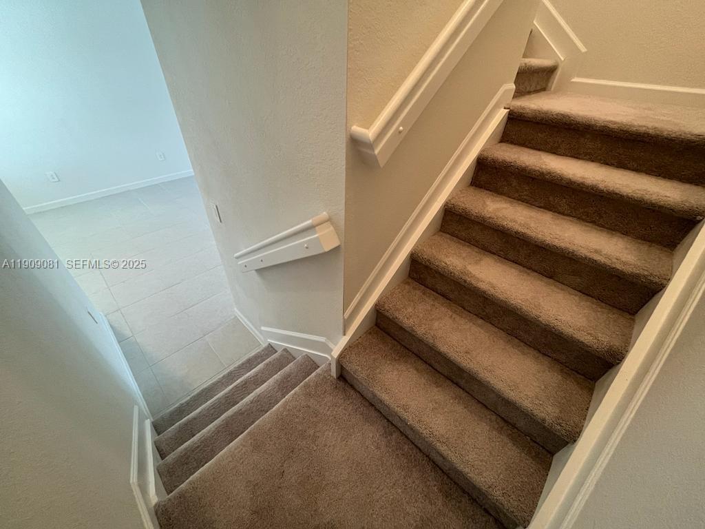 28660 Southwest 134th Court, Unit 28660 Homestead, FL 33033 - Photo 5 of 12 a view of a staircase