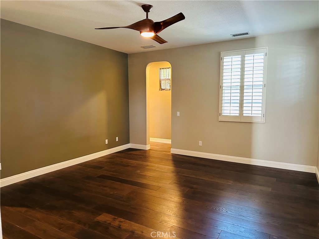 6 Carpenteria Irvine, CA 92602 - Photo 13 of 15 an empty room with wooden floor and windows