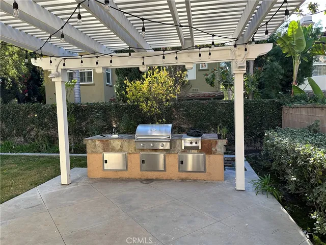 a backyard of a house with yard and outdoor seating