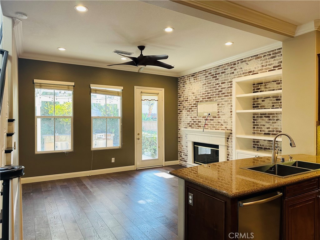 6 Carpenteria Irvine, CA 92602 - Photo 3 of 15 a living room with stainless steel appliances granite countertop a stove kitchen island a sink and a fireplace