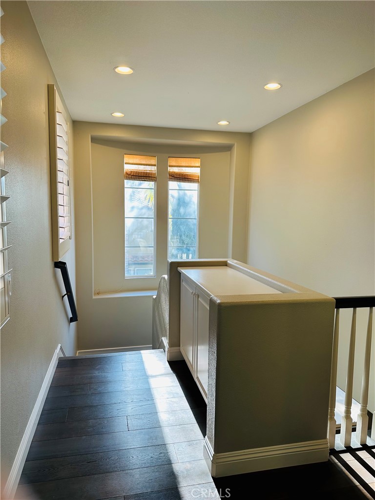 6 Carpenteria Irvine, CA 92602 - Photo 10 of 15 a view of utility room with wooden floor and fan