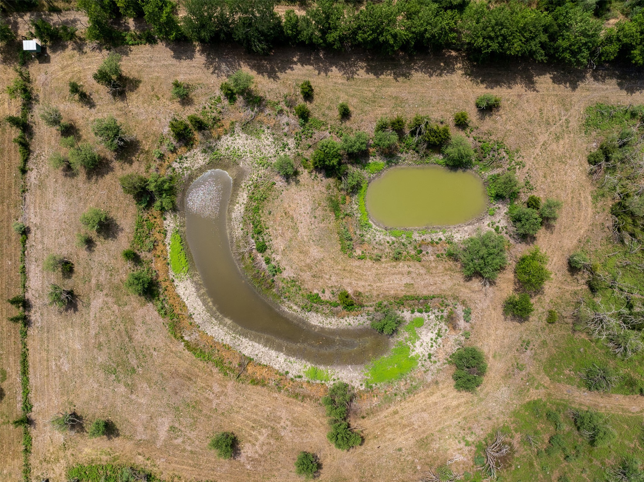 0 Ives Creek Road Bellville, TX 77418 - Photo 32 of 33 an aerial view of a house with a lake view