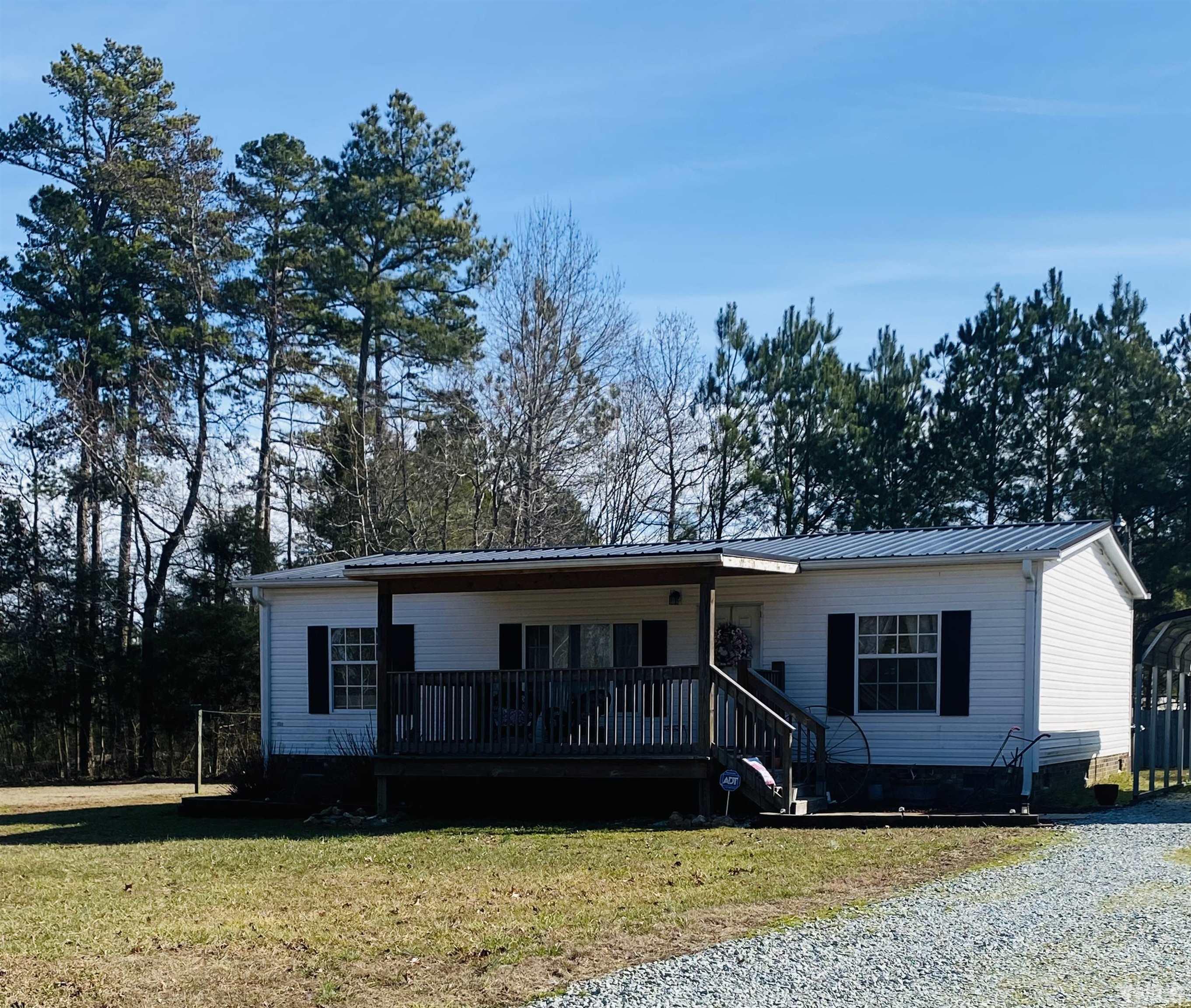 63 Rougemont Road Rougemont, NC 27572 - Photo 1 of 36 a view of a house with a yard