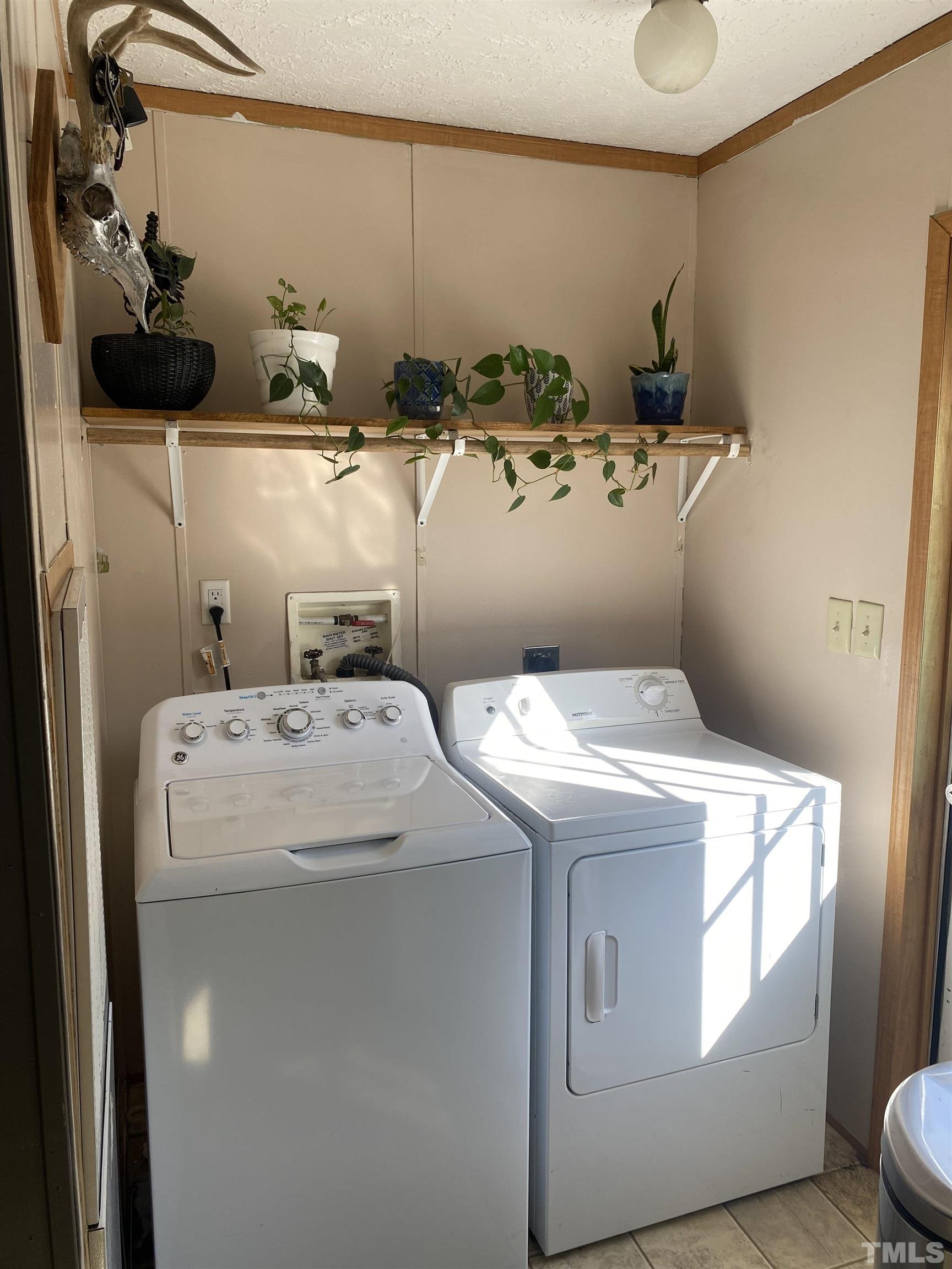 63 Rougemont Road Rougemont, NC 27572 - Photo 23 of 36 a utility room with dryer and washer