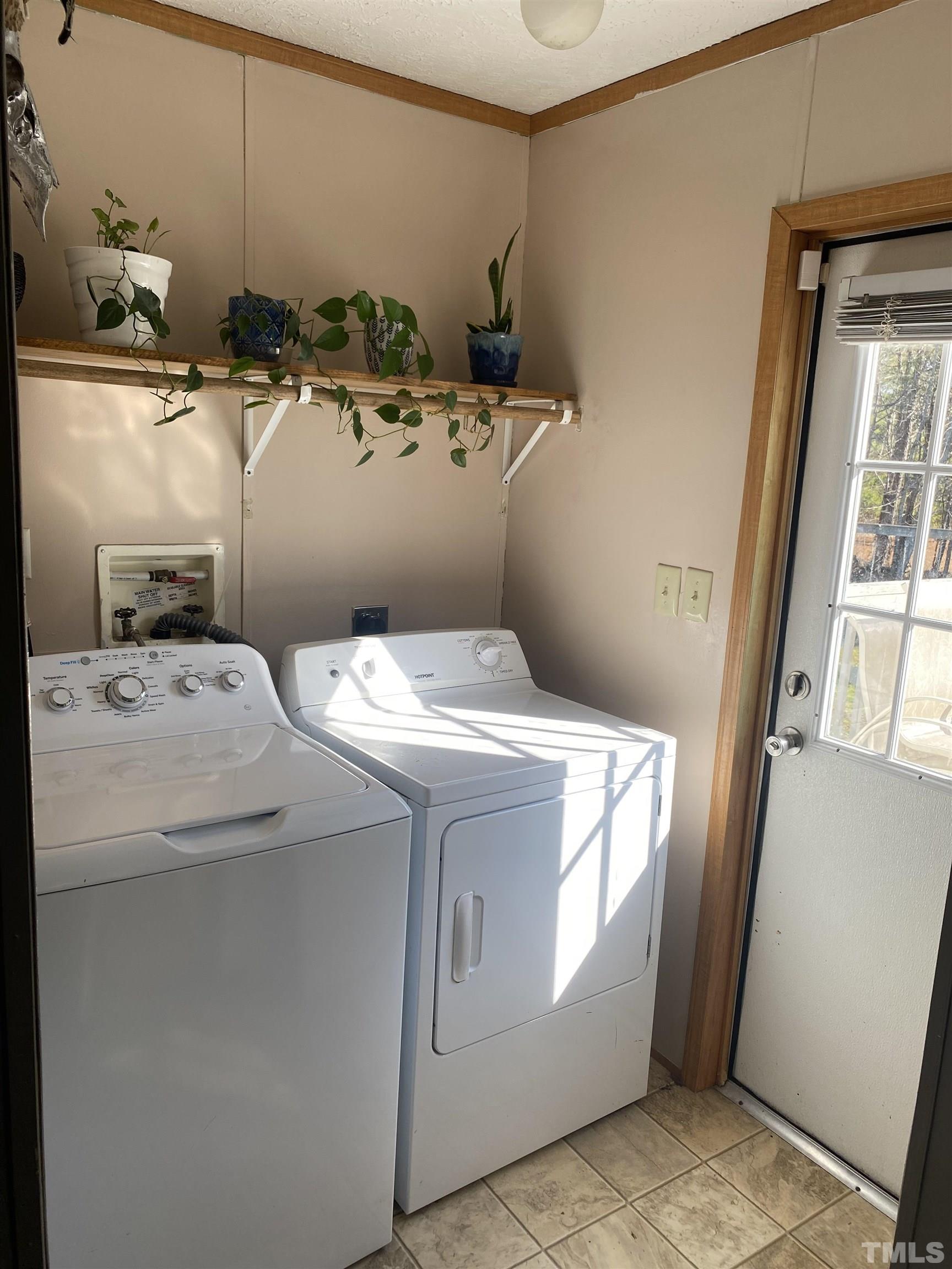 63 Rougemont Road Rougemont, NC 27572 - Photo 24 of 36 a utility room with dryer and washer