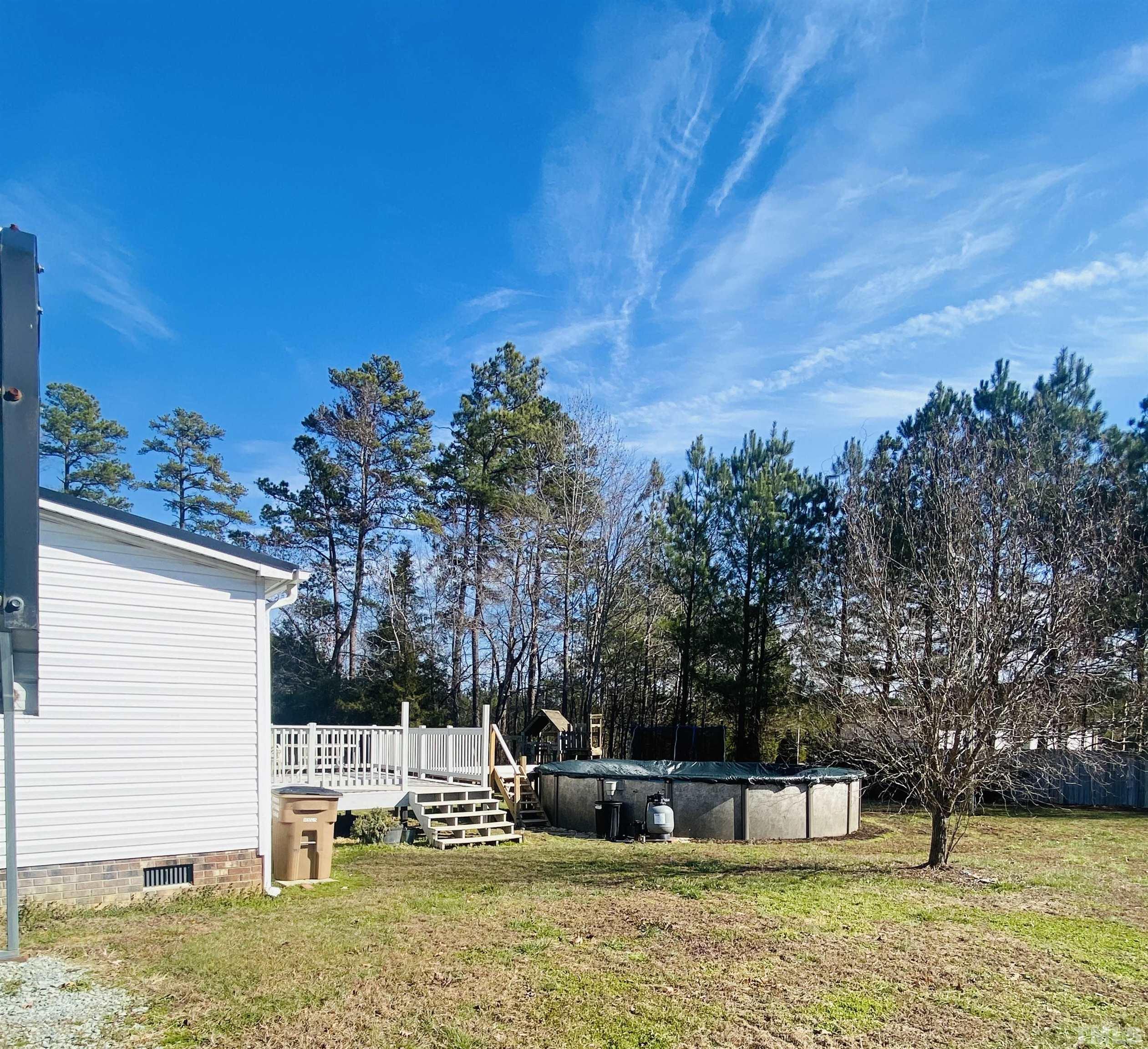 63 Rougemont Road Rougemont, NC 27572 - Photo 26 of 36 a view of a house with a yard
