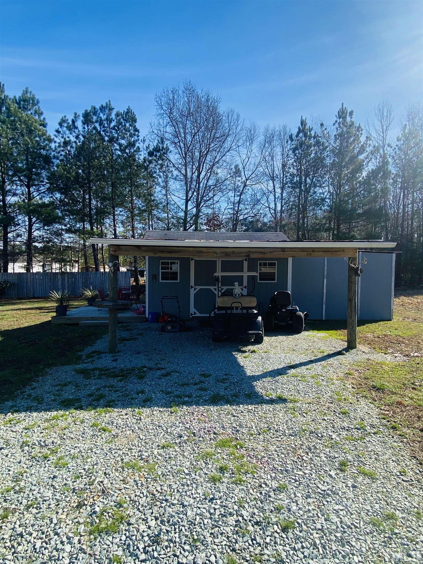 63 Rougemont Road Rougemont, NC 27572 - Photo 33 of 36 a view of a house with backyard and trees