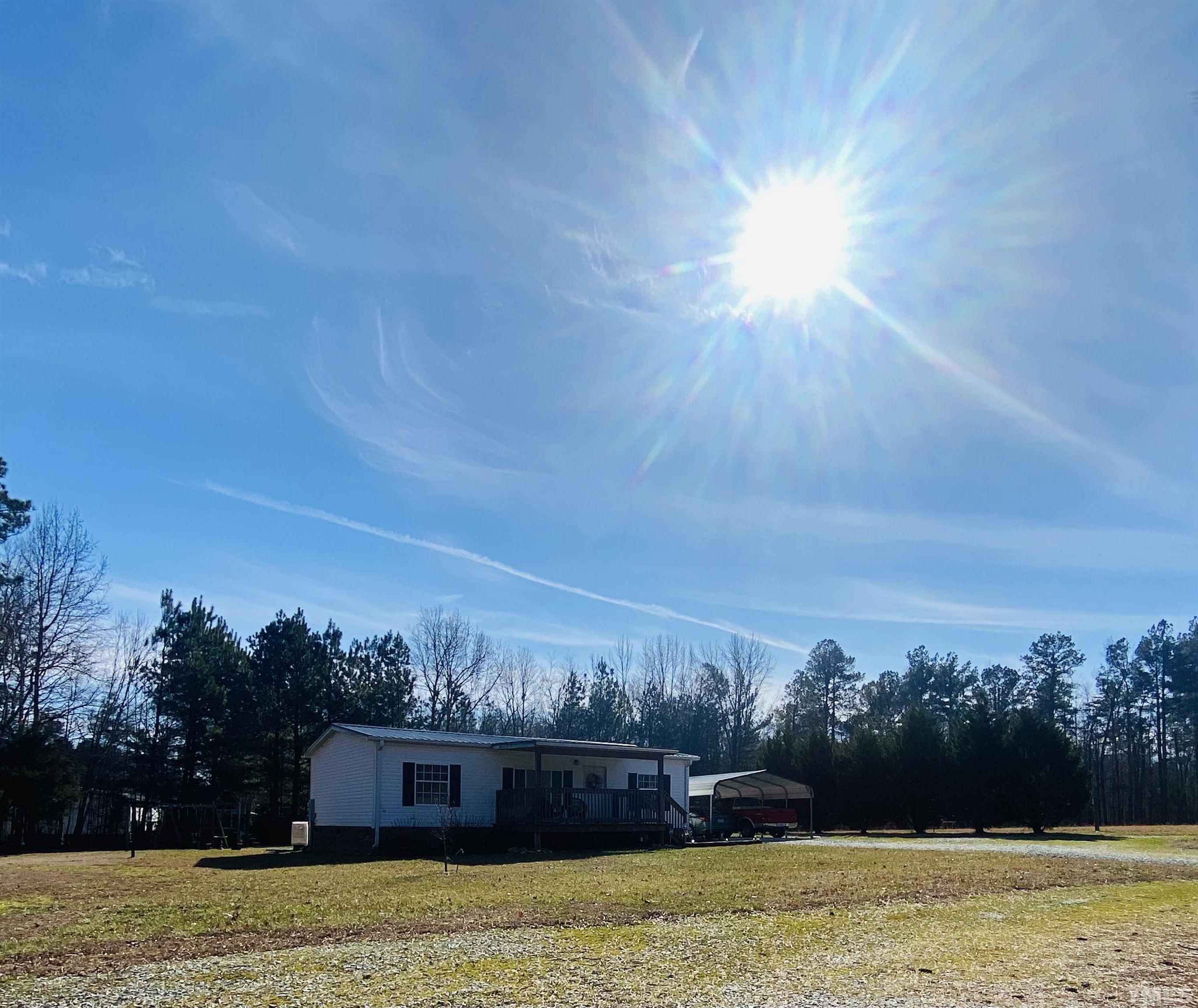 63 Rougemont Road Rougemont, NC 27572 - Photo 36 of 36 a view of a big yard with a large tree