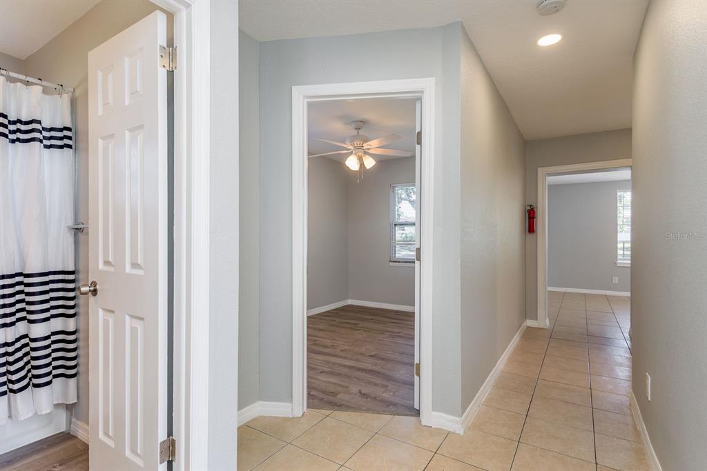13698 120th Street North Largo, FL 33778 - Photo 15 of 30 a view of a hallway with wooden floor and closet
