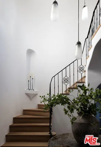 a bedroom with a bed couch and a window