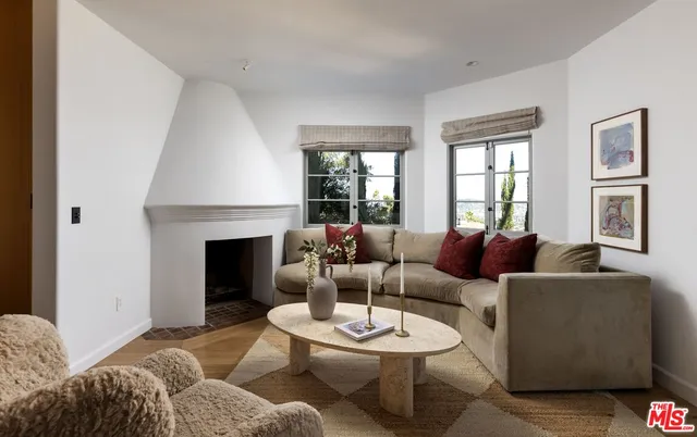 a kitchen with stainless steel appliances granite countertop a sink a stove and a wooden floor