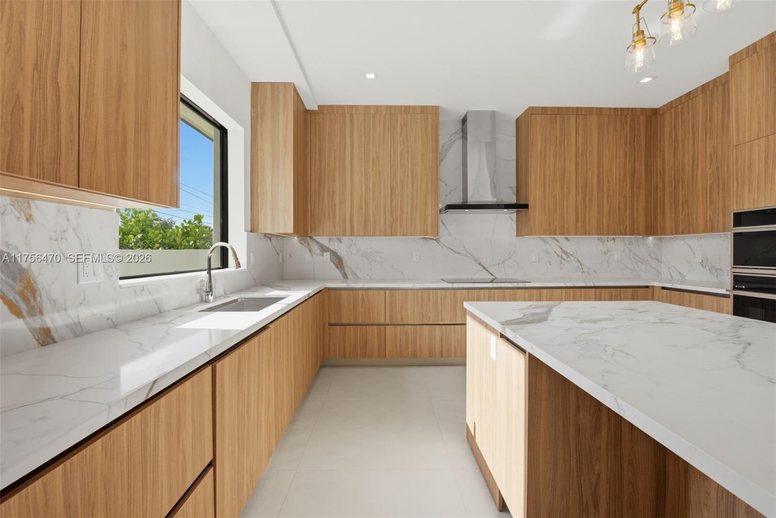 2725 Southwest 65th Avenue Miami, FL 33155 - Photo 11 of 36 a kitchen with wooden cabinets and sink