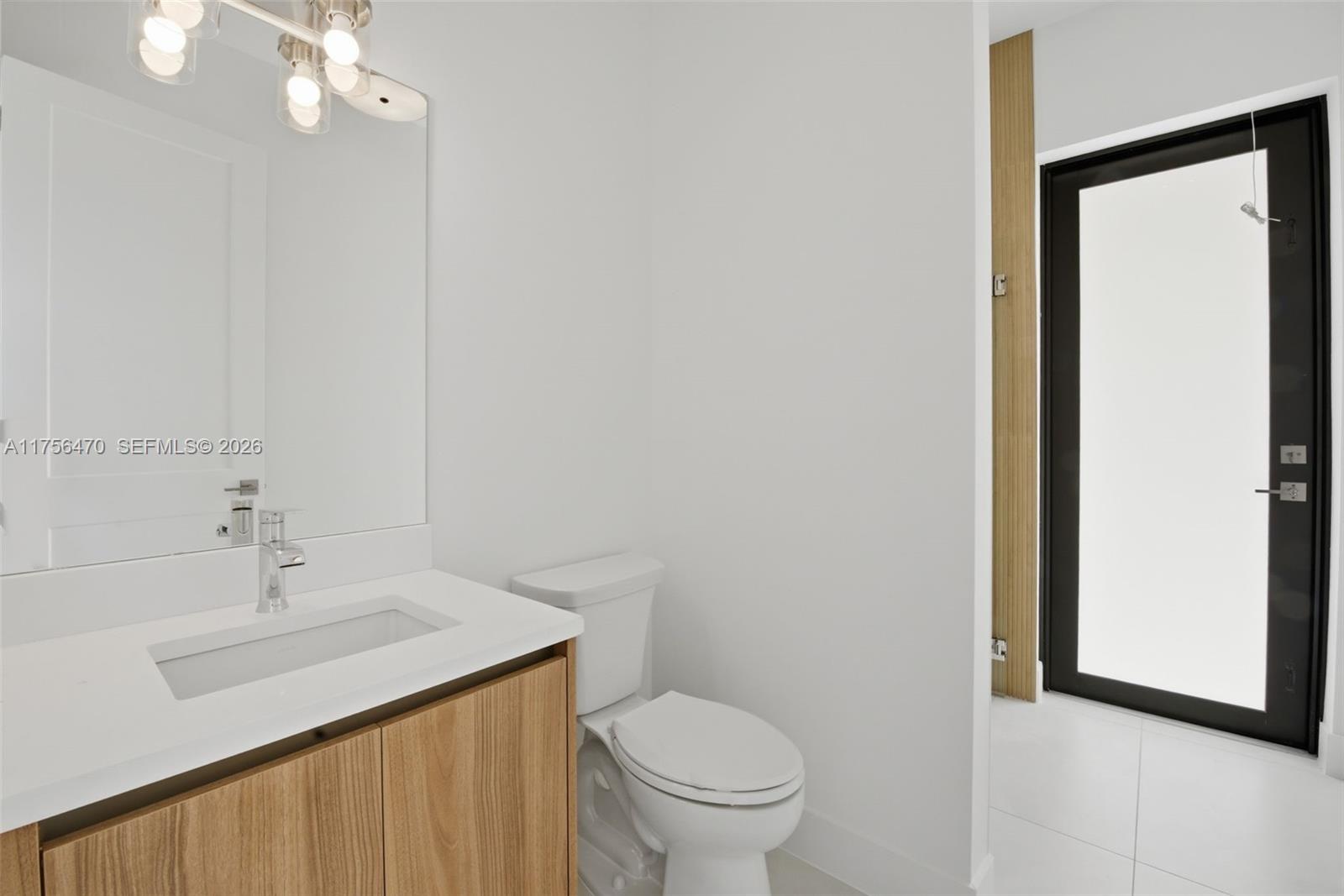 2725 Southwest 65th Avenue Miami, FL 33155 - Photo 13 of 36 a bathroom with a sink toilet and vanity
