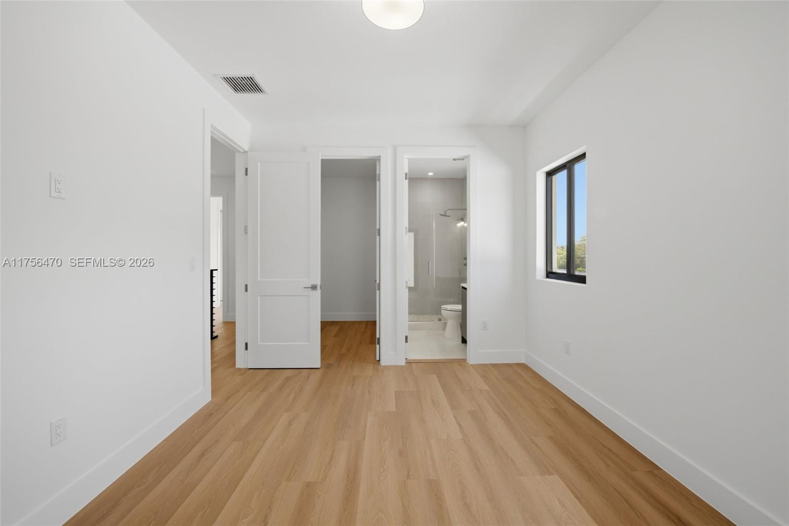 2725 Southwest 65th Avenue Miami, FL 33155 - Photo 17 of 36 a view of a room with wooden floor and a window