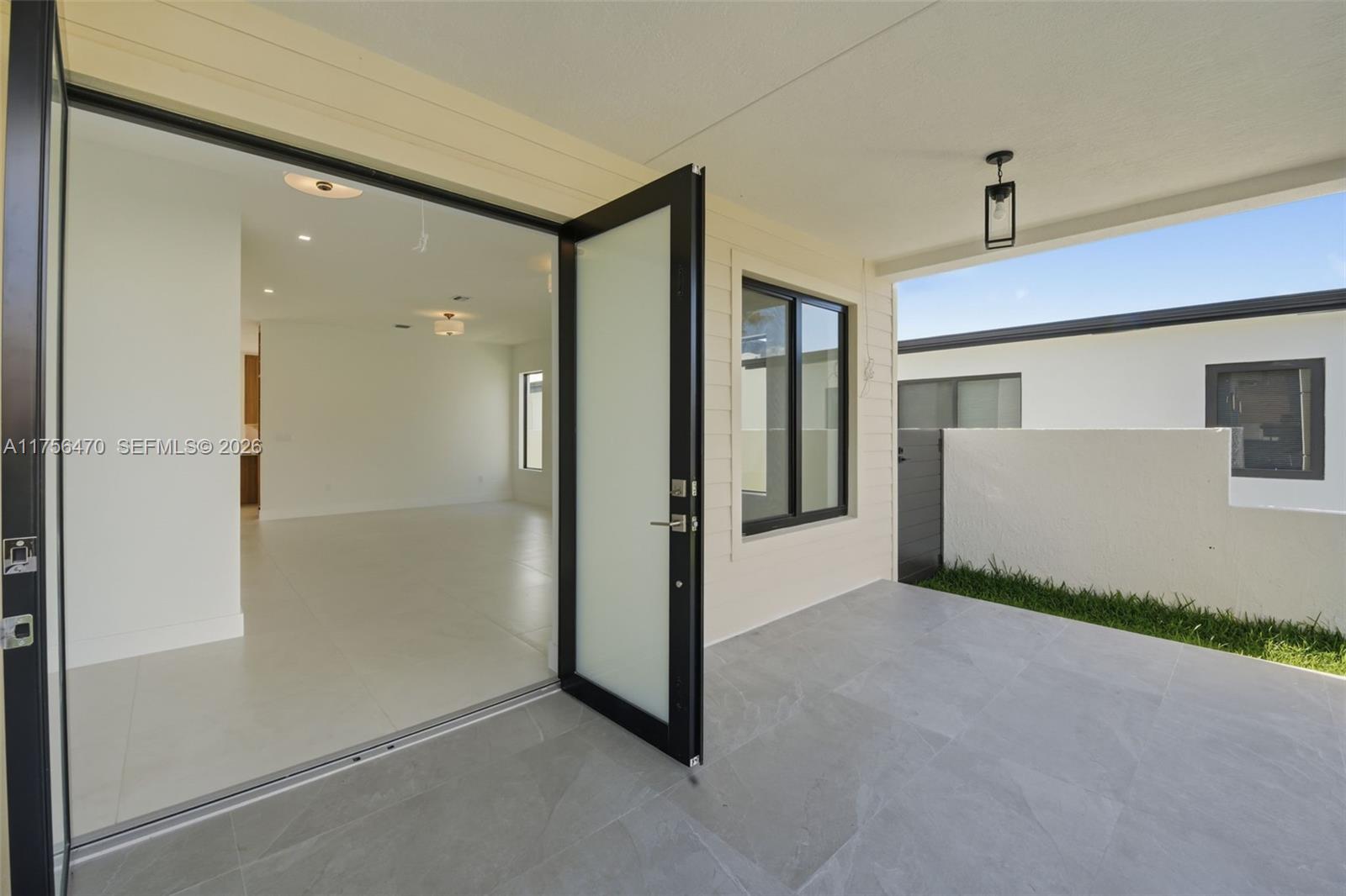 2725 Southwest 65th Avenue Miami, FL 33155 - Photo 2 of 36 a view of a hallway with a livingroom