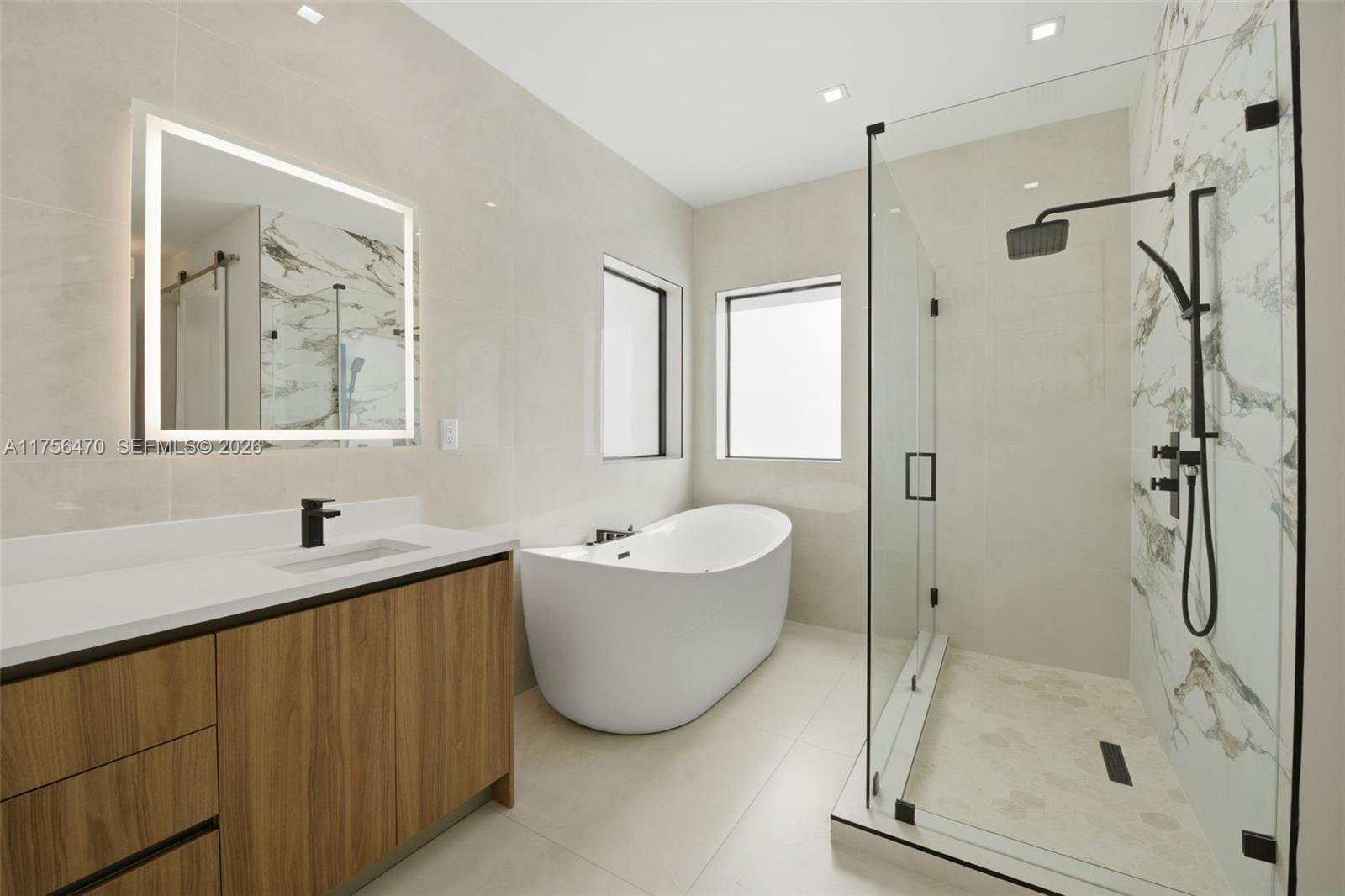 2725 Southwest 65th Avenue Miami, FL 33155 - Photo 25 of 36 a bathroom with a tub shower and sink