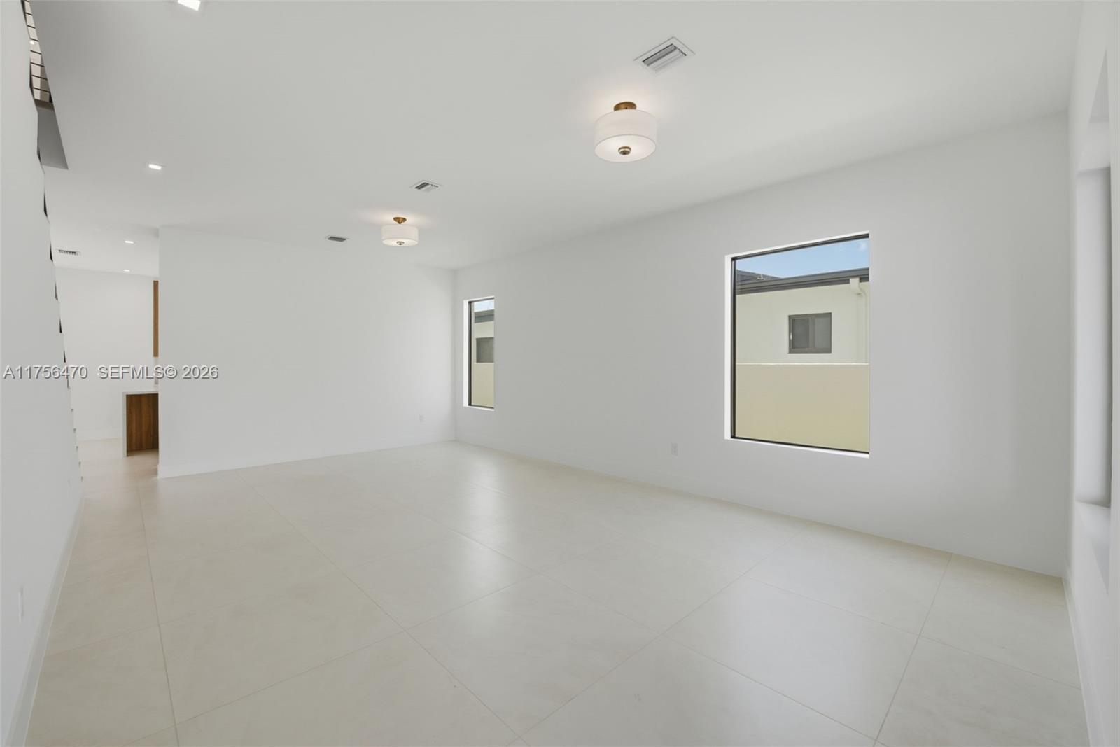 2725 Southwest 65th Avenue Miami, FL 33155 - Photo 3 of 36 an empty room with a empty space and windows