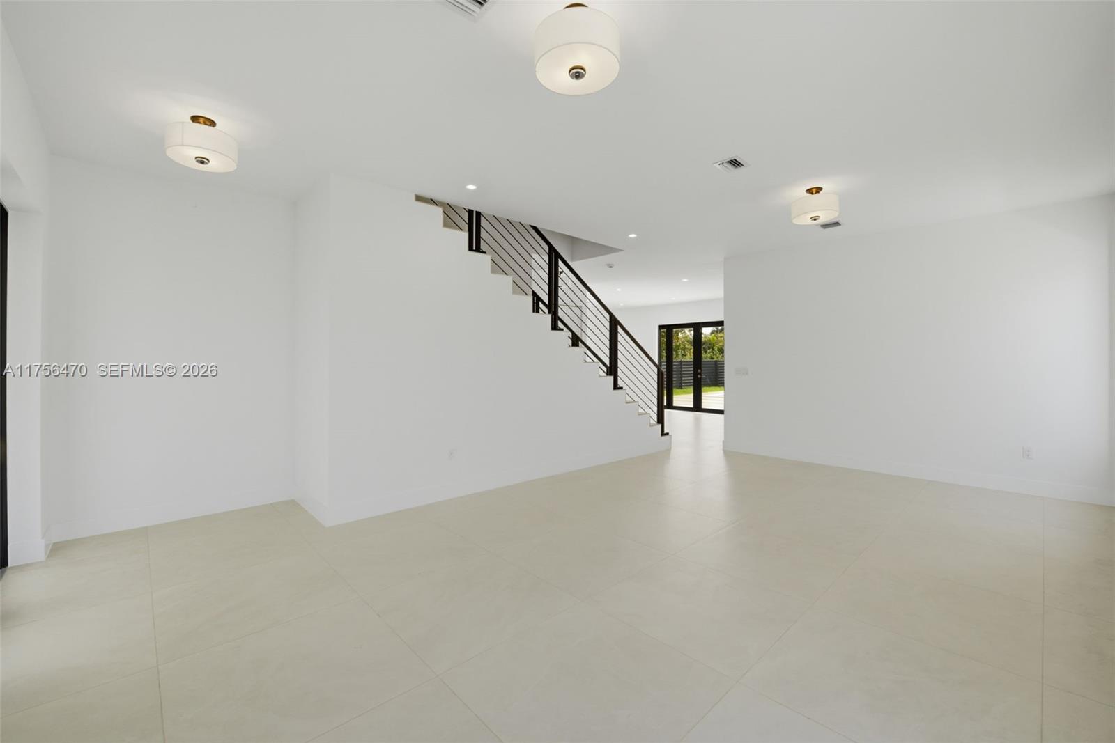 2725 Southwest 65th Avenue Miami, FL 33155 - Photo 4 of 36 a view of an empty room with stairs