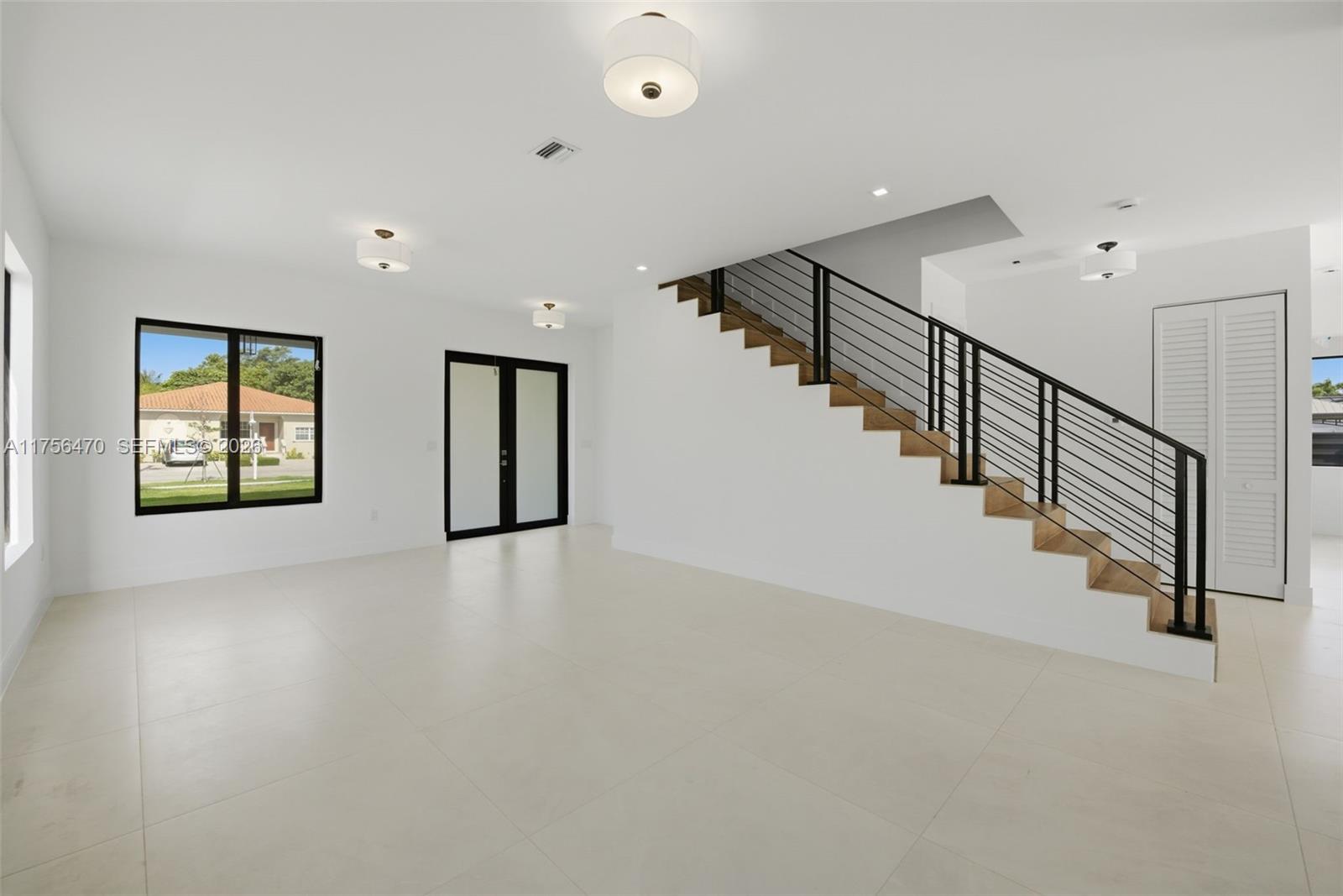 2725 Southwest 65th Avenue Miami, FL 33155 - Photo 5 of 36 a view of an entryway with stairs