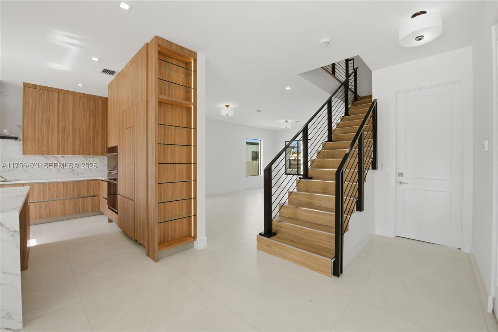 2725 Southwest 65th Avenue Miami, FL 33155 - Photo 7 of 36 a view of entryway with wooden floor and stairs
