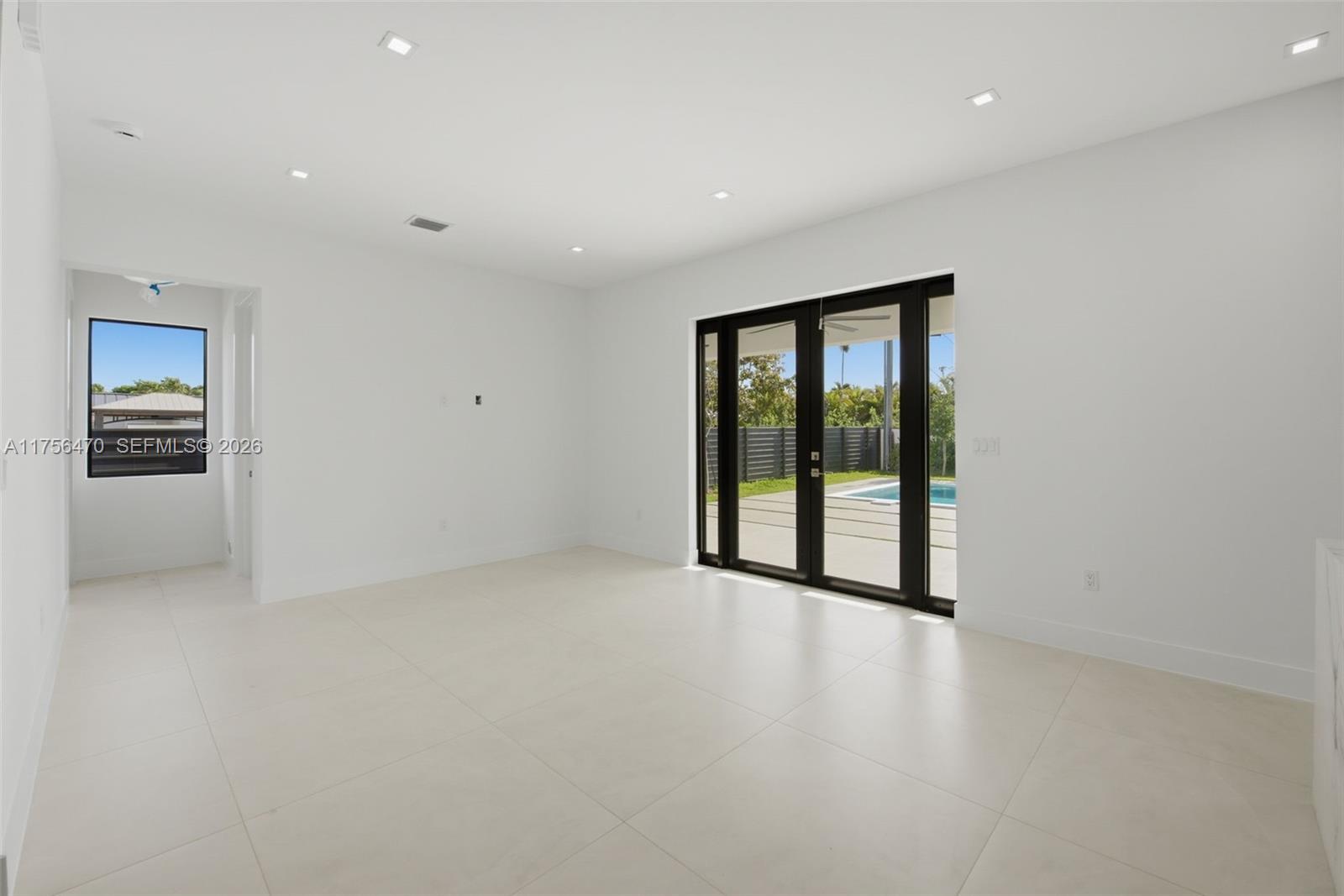 2725 Southwest 65th Avenue Miami, FL 33155 - Photo 8 of 36 a view of an empty room with a window