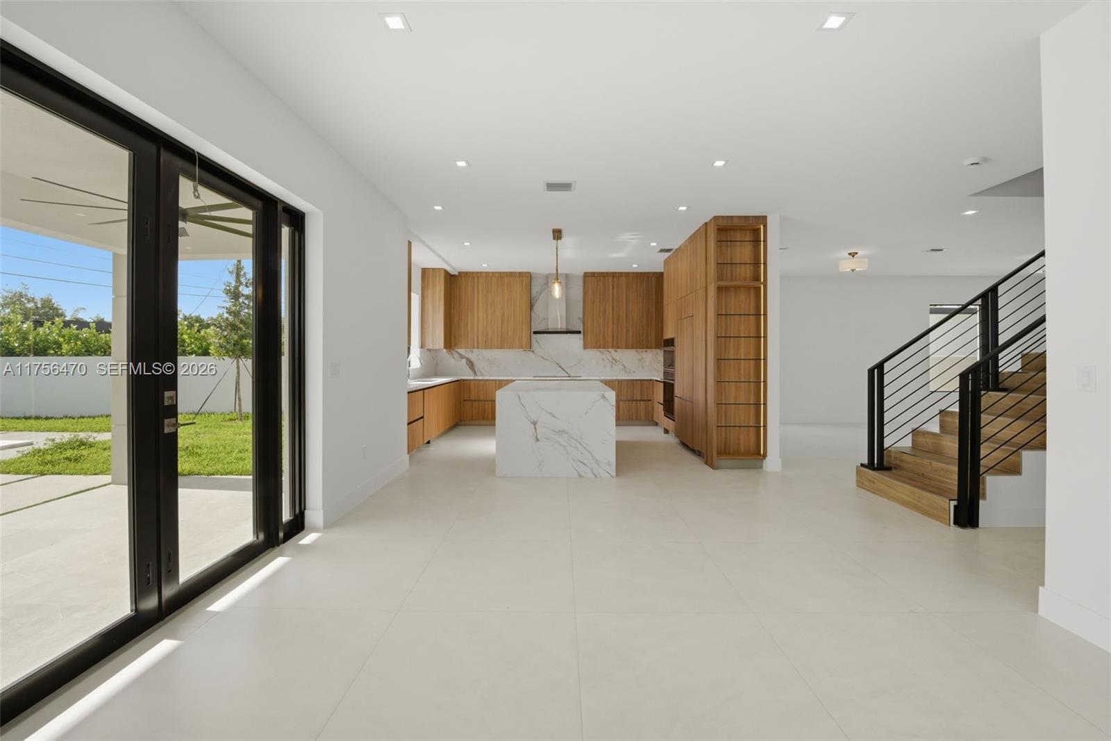 2725 Southwest 65th Avenue Miami, FL 33155 - Photo 9 of 36 a large white room with glass doors