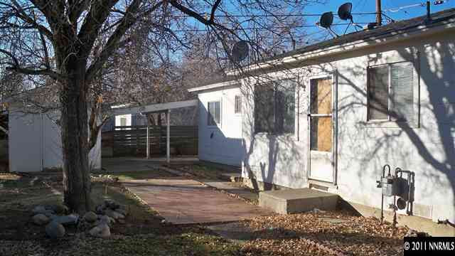 1490 Montello Street Reno, NV 89512 - Photo 8 of 13 a view of a house with a yard