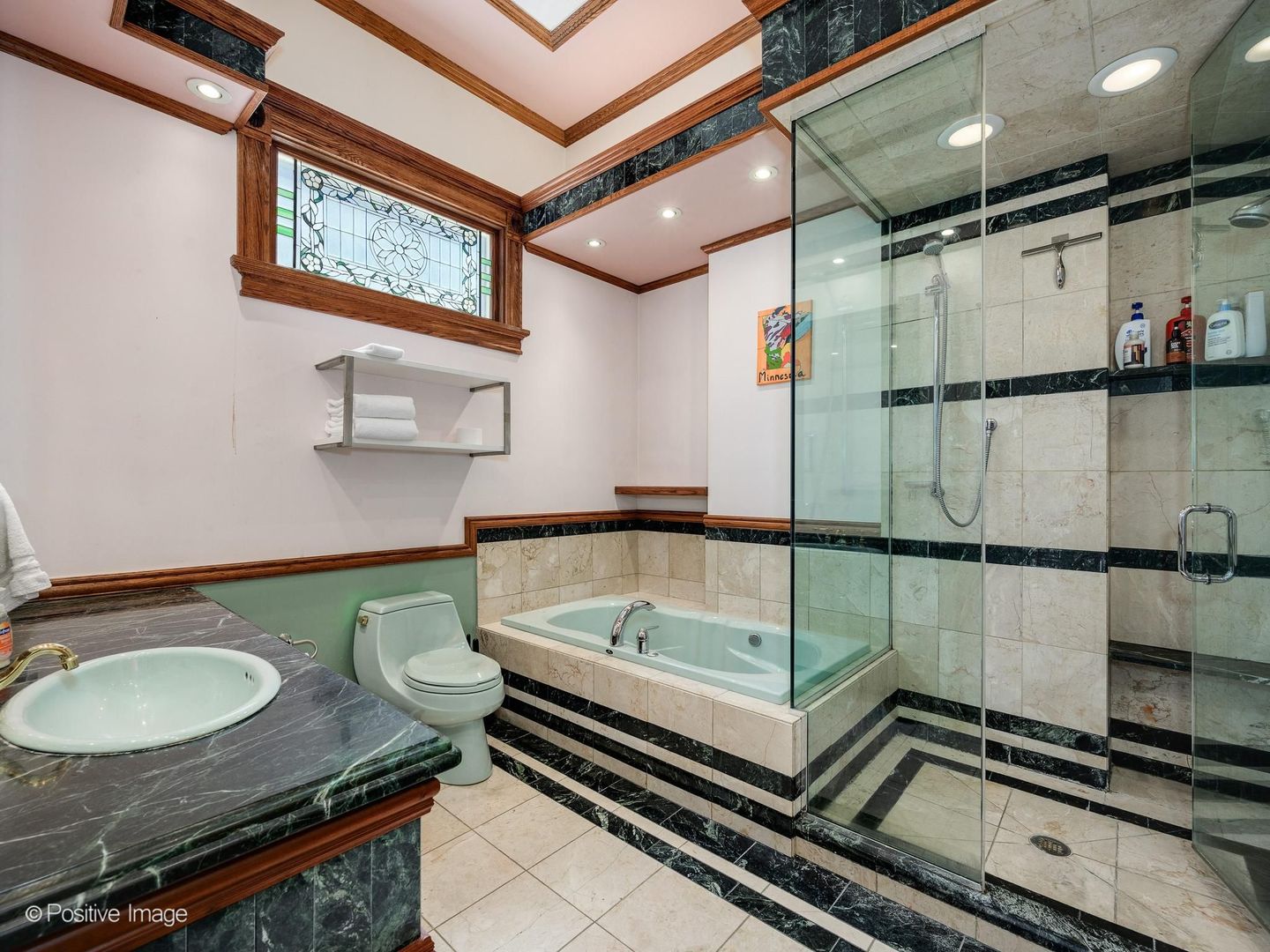 33 East Division Street Chicago, IL 60611 - Photo 21 of 34 a bathroom with a sink a mirror and a shower