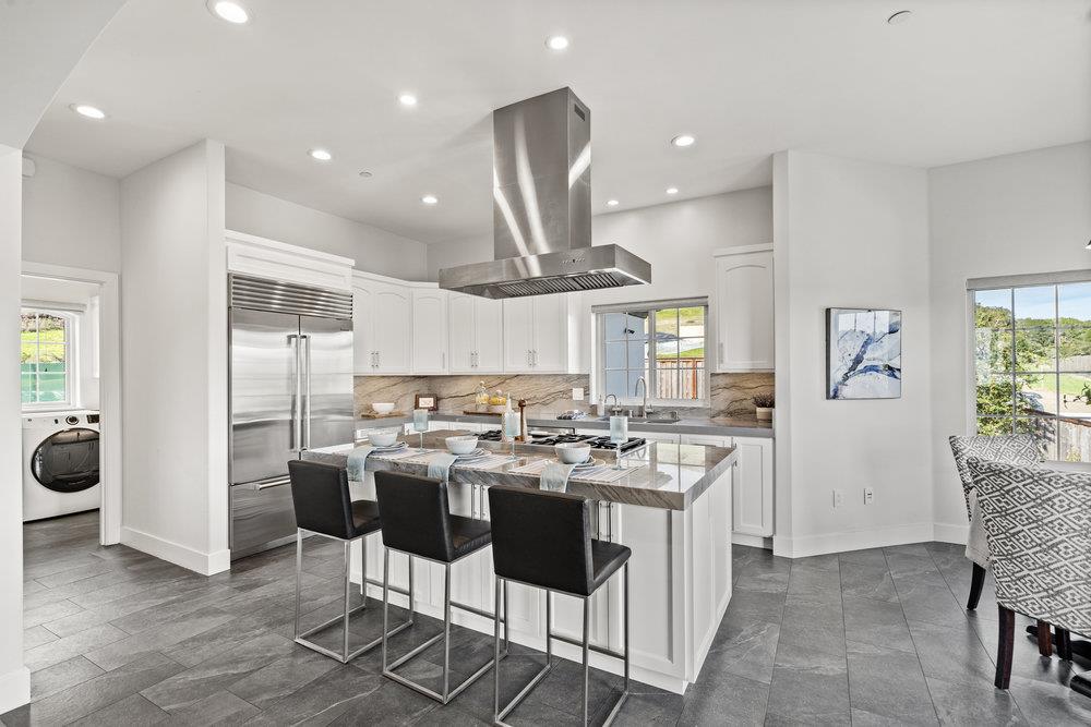 40 Indy Circle Soquel, CA 95073 - Photo 18 of 65 a kitchen with kitchen island granite countertop a sink and stove