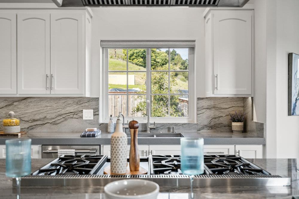 40 Indy Circle Soquel, CA 95073 - Photo 24 of 65 a kitchen with sink a stove and white cabinets