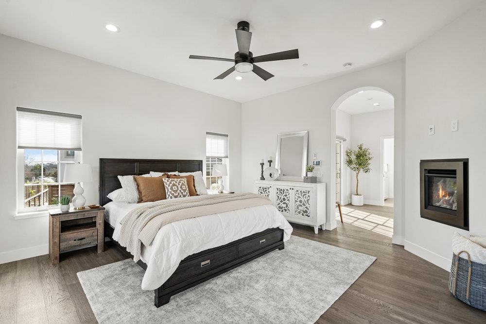40 Indy Circle Soquel, CA 95073 - Photo 33 of 65 a bedroom with a large bed and wooden floor