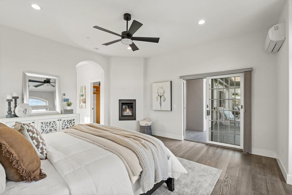 40 Indy Circle Soquel, CA 95073 - Photo 34 of 65 a bedroom with a large bed and a chandelier