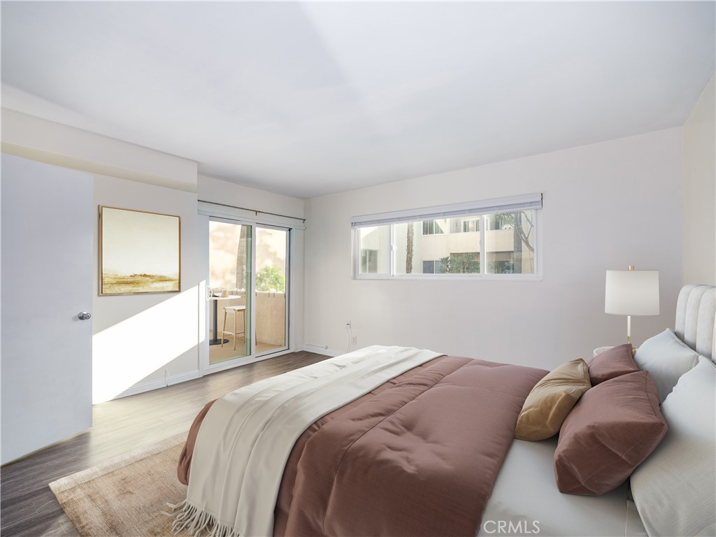 5411 Tyrone Avenue Sherman Oaks, CA 91401 - Photo 17 of 28 a bedroom with a bed and a window