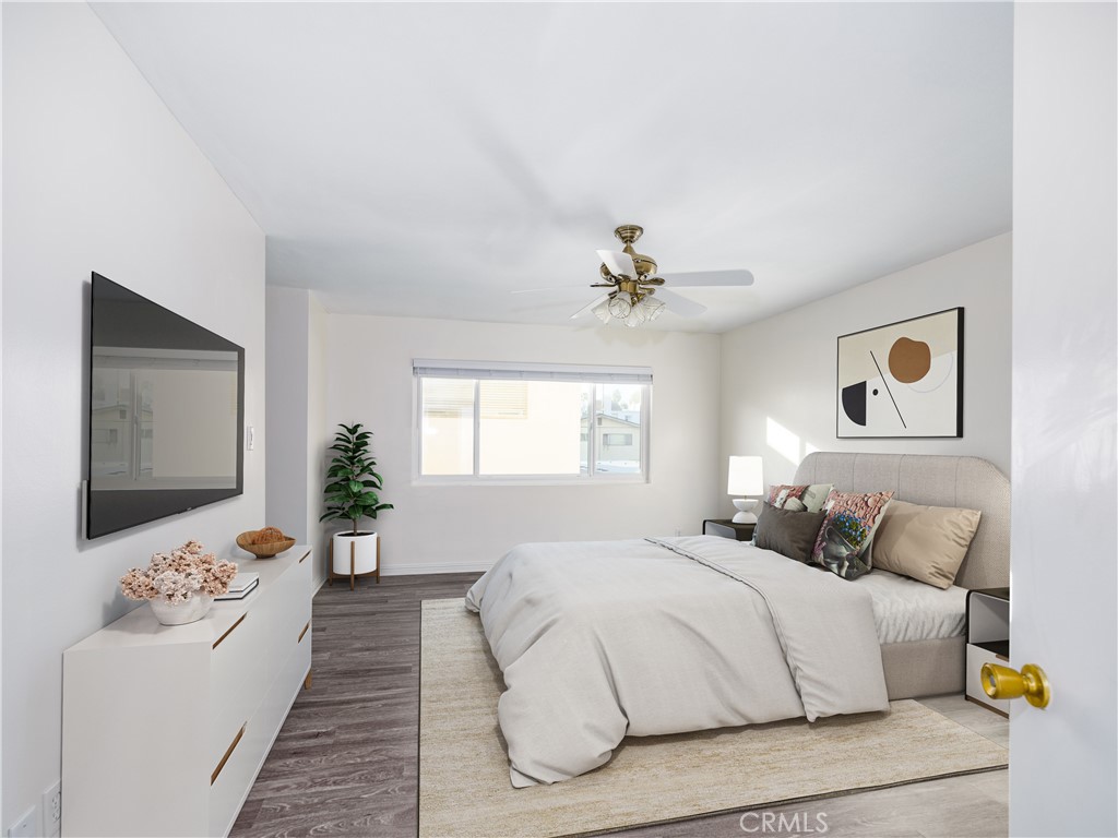 5411 Tyrone Avenue Sherman Oaks, CA 91401 - Photo 20 of 28 a bedroom with a large bed and a chandelier